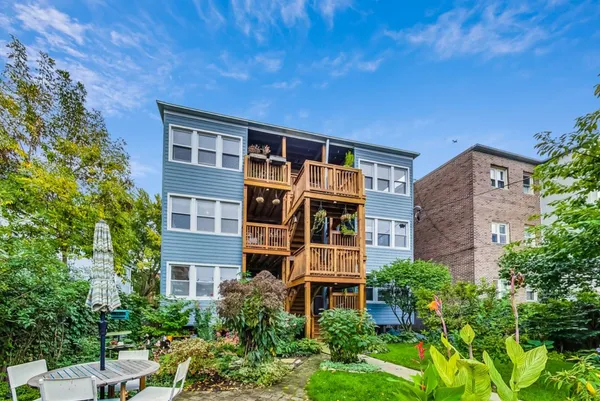 a view of a backyard with sitting area