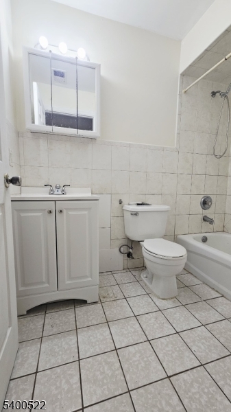 306 1st Street, Unit 1 Elizabeth Port, NJ 07206 - Photo 11 of 23 a bathroom with a toilet a sink and mirror