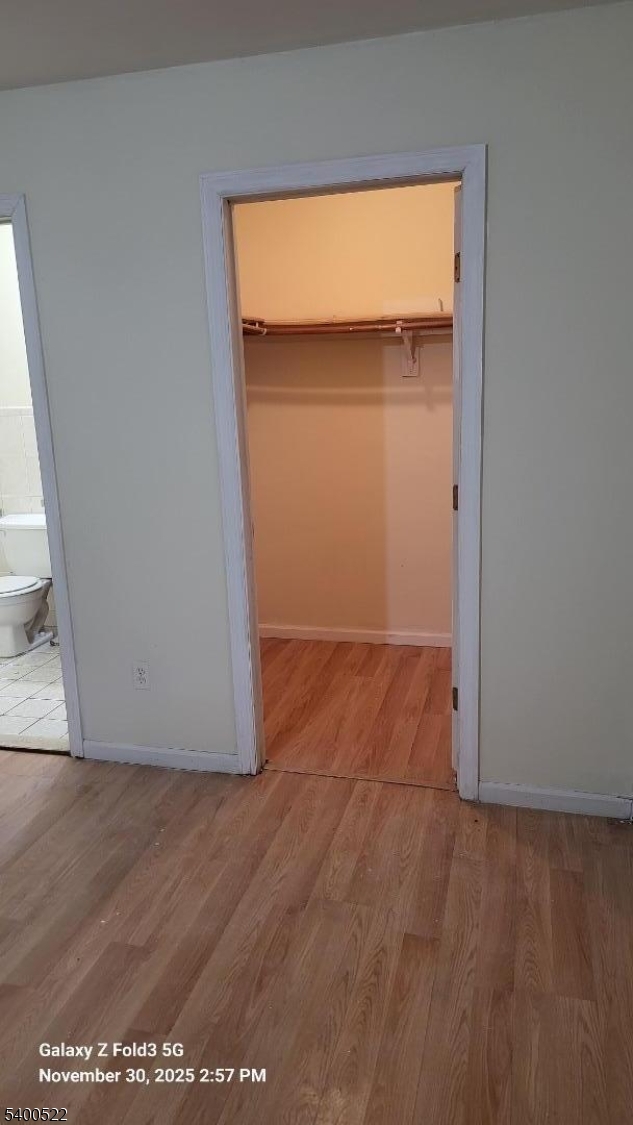 306 1st Street, Unit 1 Elizabeth Port, NJ 07206 - Photo 14 of 23 an empty room with wooden floor and a window