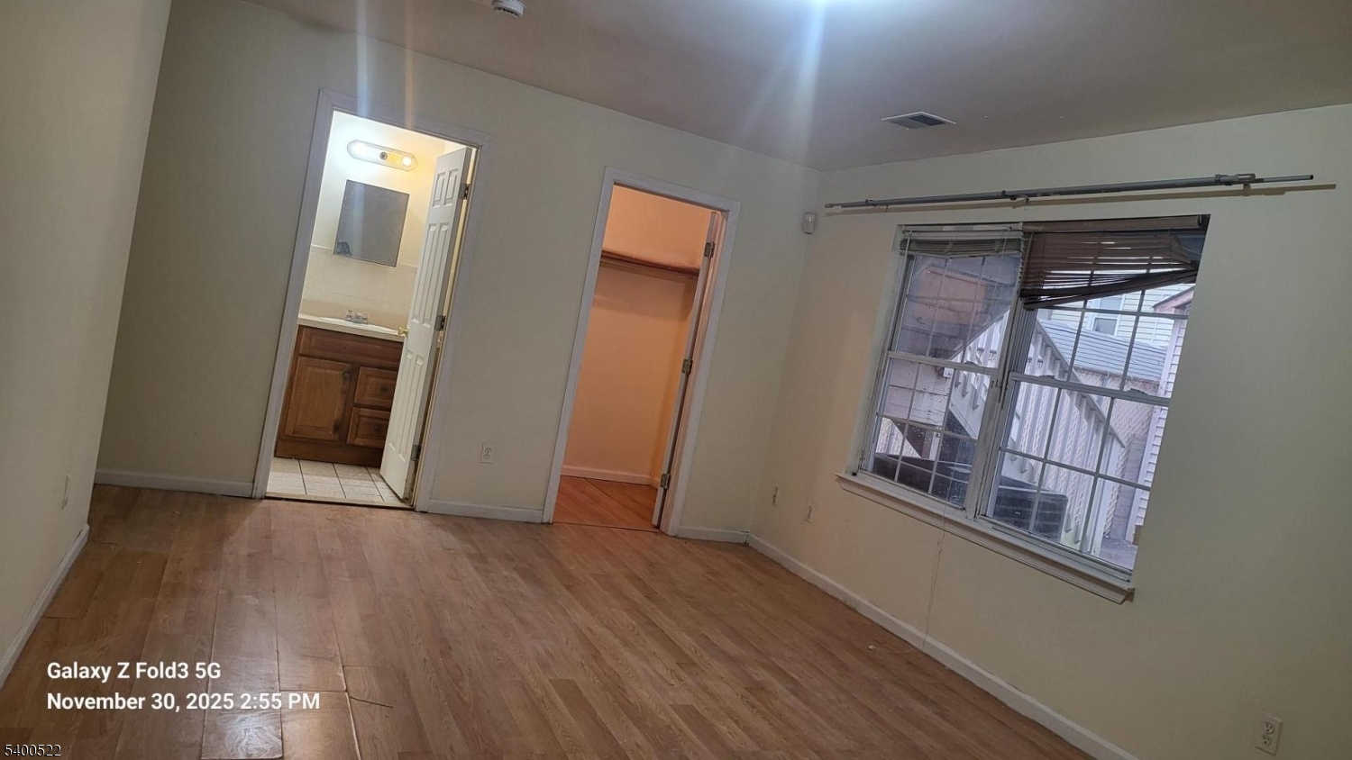 306 1st Street, Unit 1 Elizabeth Port, NJ 07206 - Photo 16 of 23 an empty room with wooden floor and windows