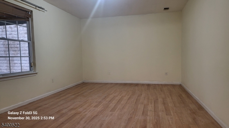 306 1st Street, Unit 1 Elizabeth Port, NJ 07206 - Photo 17 of 23 a view of an empty room and window