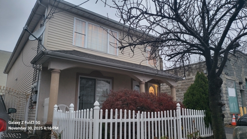 306 1st Street, Unit 1 Elizabeth Port, NJ 07206 - Photo 2 of 23 a front view of a house