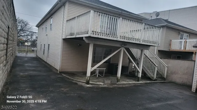 a front view of a house with wooden stairs