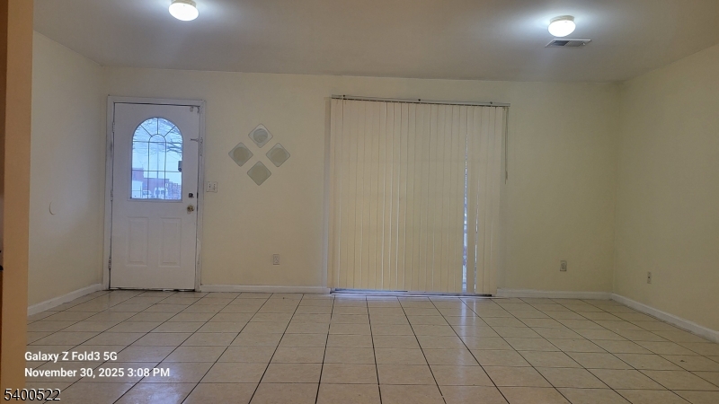 306 1st Street, Unit 1 Elizabeth Port, NJ 07206 - Photo 3 of 23 an empty room with windows
