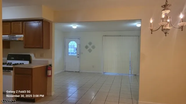 a view of a kitchen from the hallway