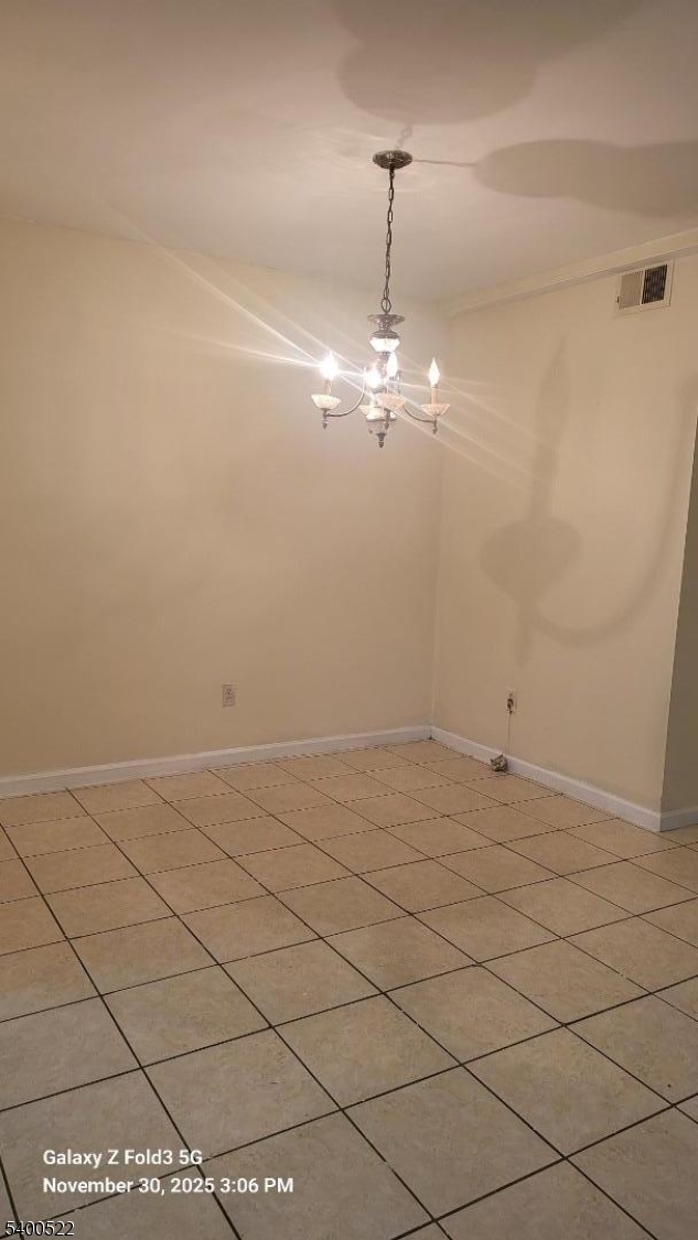 306 1st Street, Unit 1 Elizabeth Port, NJ 07206 - Photo 7 of 23 a view of a room with marble wall and chandelier