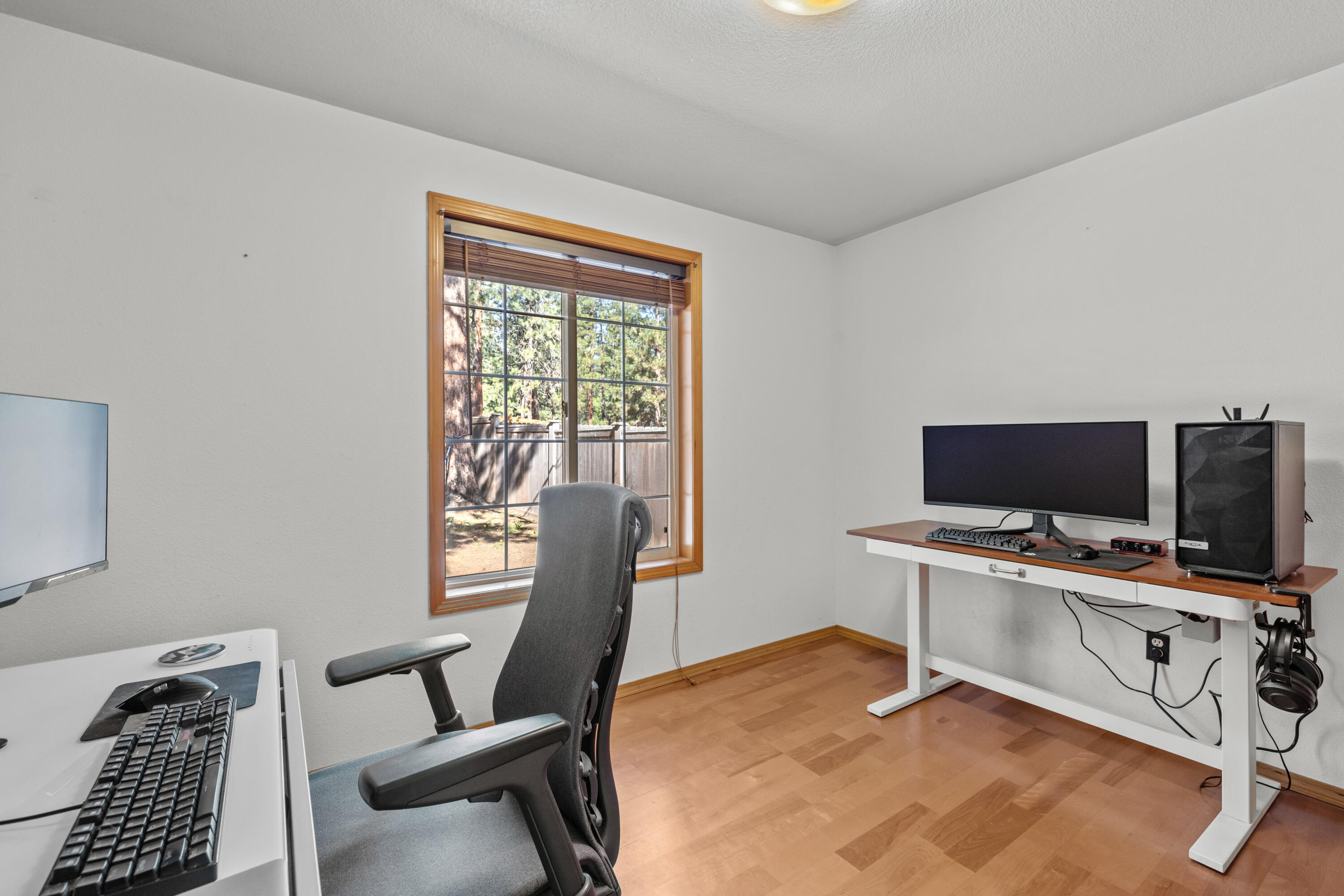19102 Choctaw Road Bend, OR 97702 - Photo 9 of 14 a view of a workspace with furniture and a window