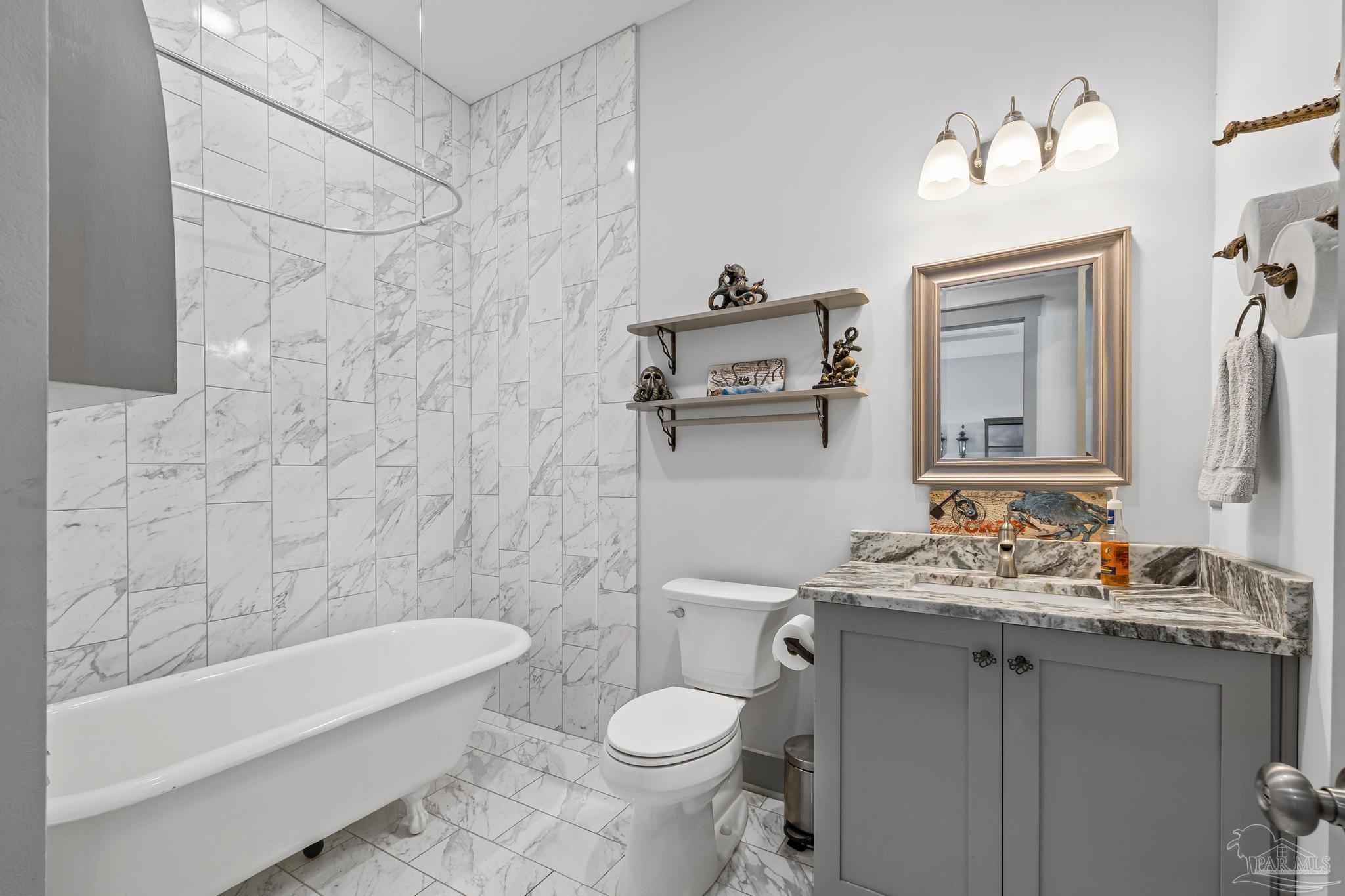 305 Garcon Point Road Milton, FL 32583 - Photo 29 of 72 a bathroom with a sink toilet and shower