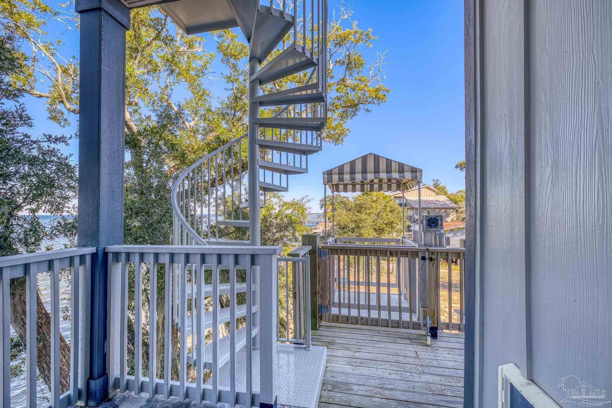 305 Garcon Point Road Milton, FL 32583 - Photo 50 of 72 a view of a brick house with a large window