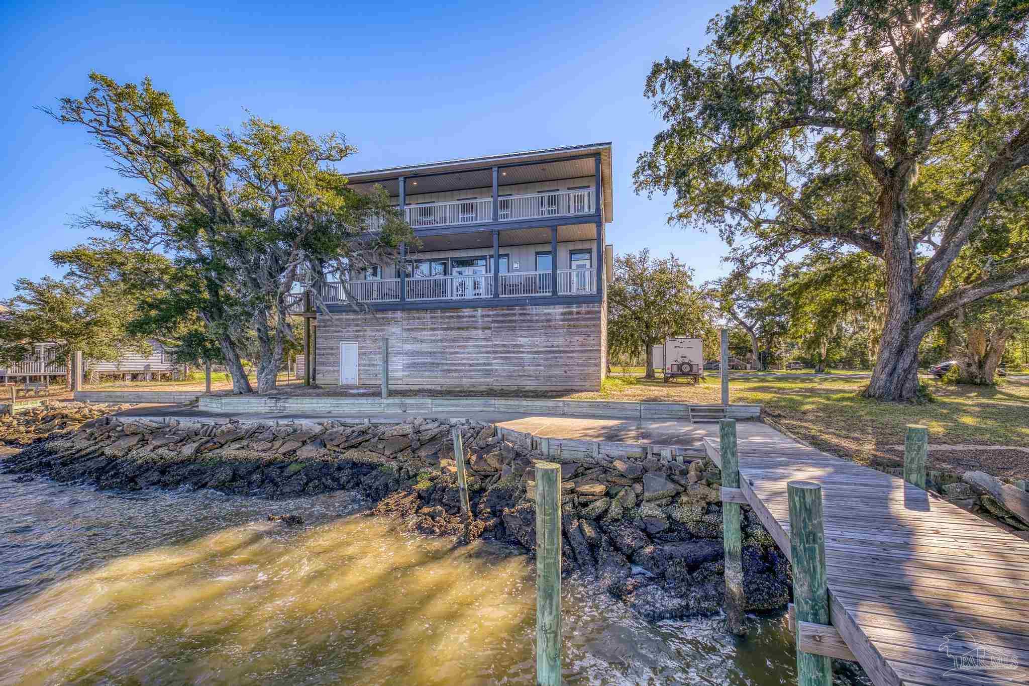305 Garcon Point Road Milton, FL 32583 - Photo 59 of 72 a view of a yard with plants