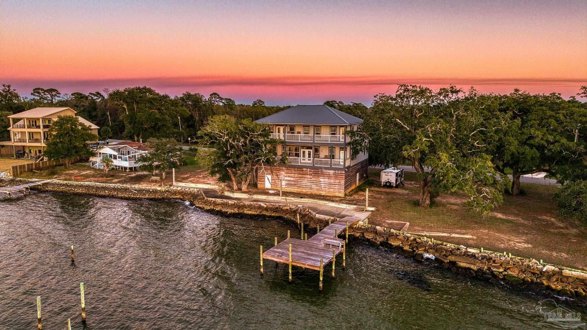 305 Garcon Point Road Milton, FL 32583 - Photo 70 of 72 a view of swimming pool with outdoor seating and city view