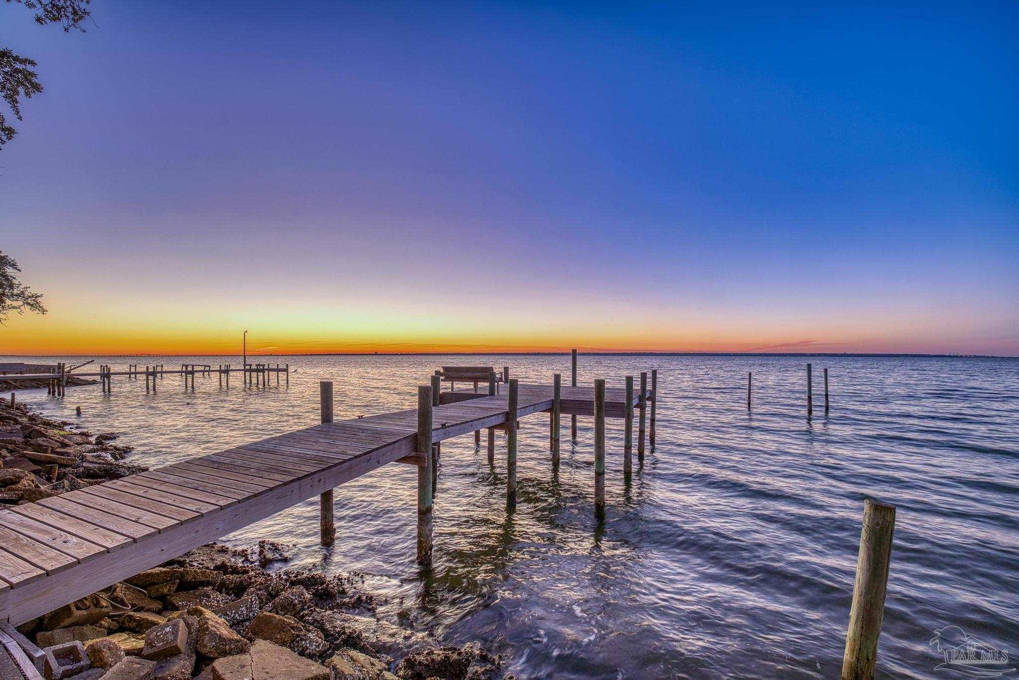 305 Garcon Point Road Milton, FL 32583 - Photo 8 of 72 a view of a balcony with an ocean view