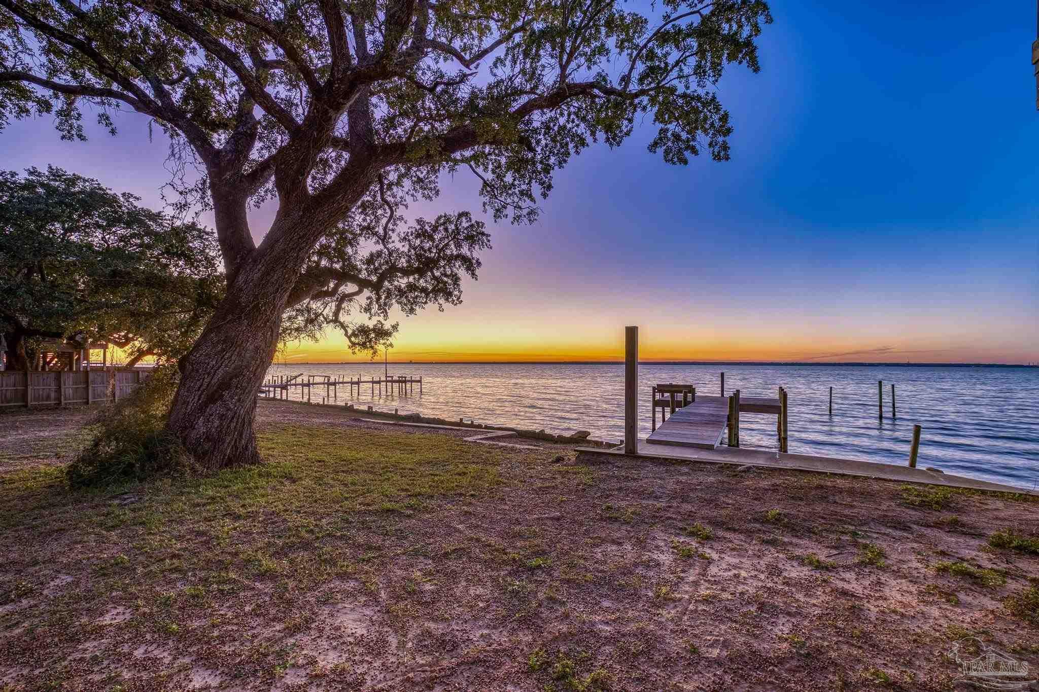 305 Garcon Point Road Milton, FL 32583 - Photo 10 of 72 a view of an outdoor space and yard