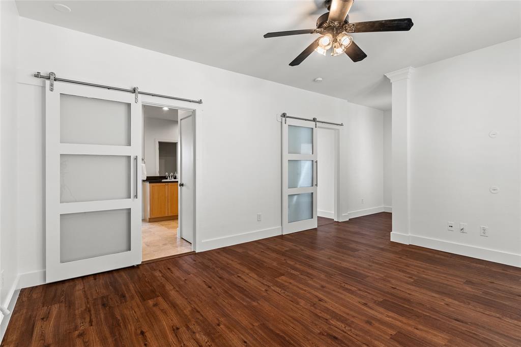4830 Cedar Springs Road, Unit 3 Dallas, TX 75219 - Photo 12 of 19 Primary Bedroom view to bathroom