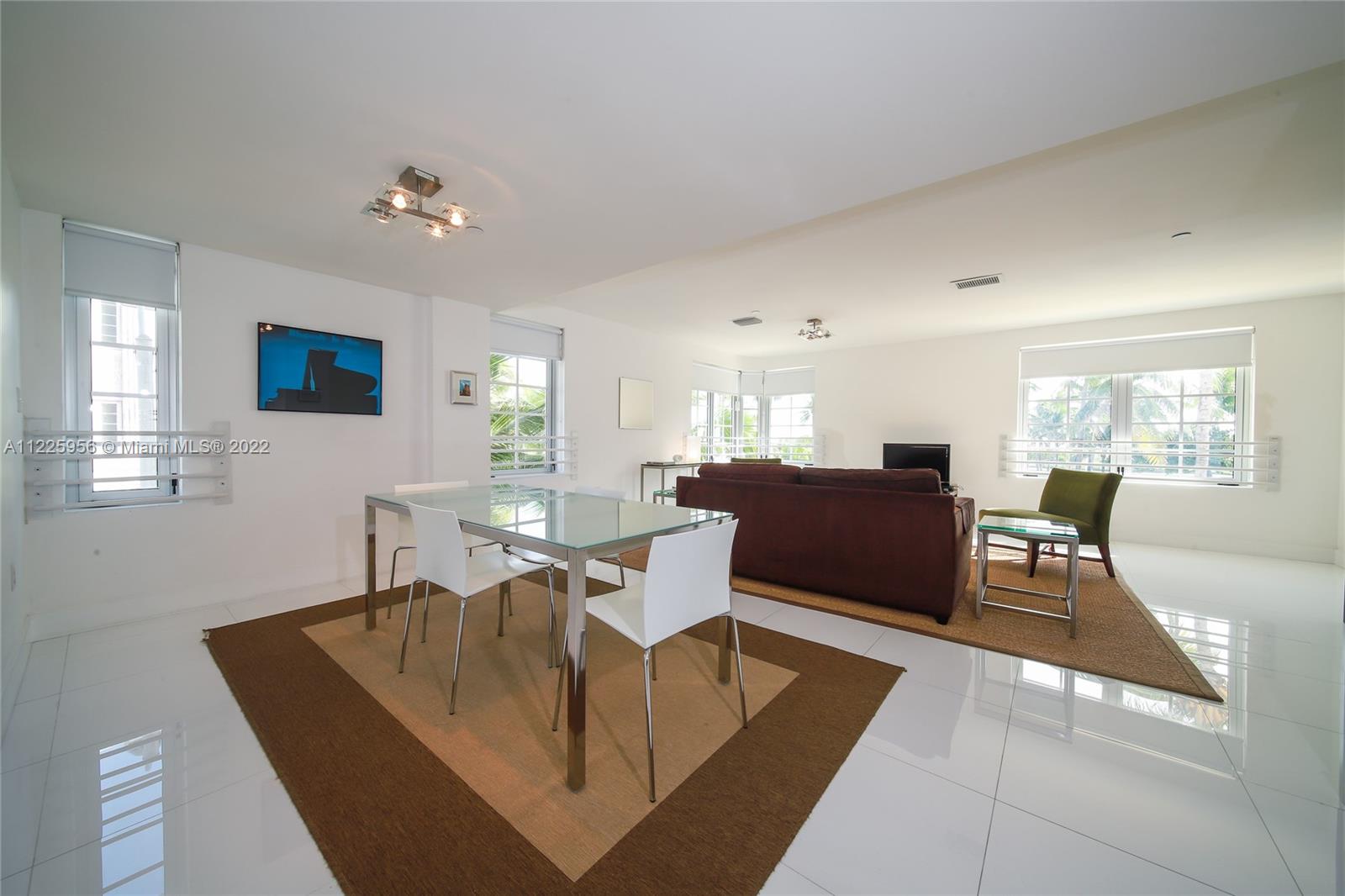 Flamingo-Lummus Miami Beach, FL 33139 - Photo 15 of 28 a living room with couches a computer on desk and chair