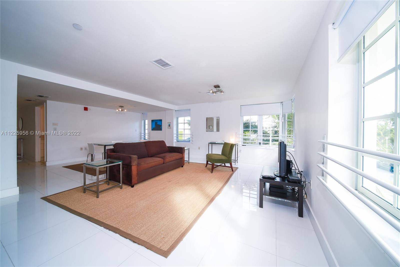 Flamingo-Lummus Miami Beach, FL 33139 - Photo 19 of 28 a living room with furniture and a large window