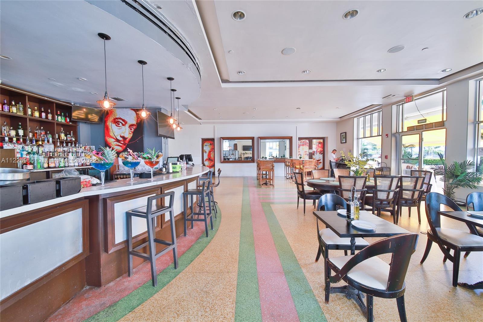 Flamingo-Lummus Miami Beach, FL 33139 - Photo 28 of 28 a dining room with stainless steel appliances kitchen island granite countertop a table chairs and a dining table view