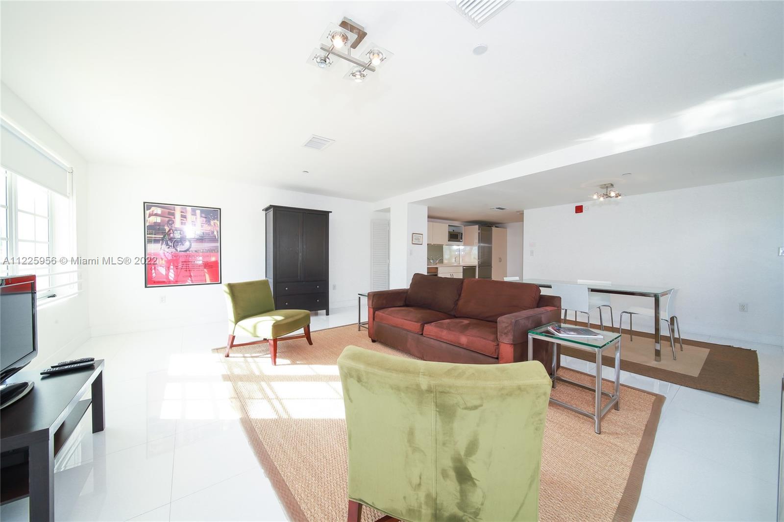 Flamingo-Lummus Miami Beach, FL 33139 - Photo 10 of 28 a living room with furniture and a flat screen tv