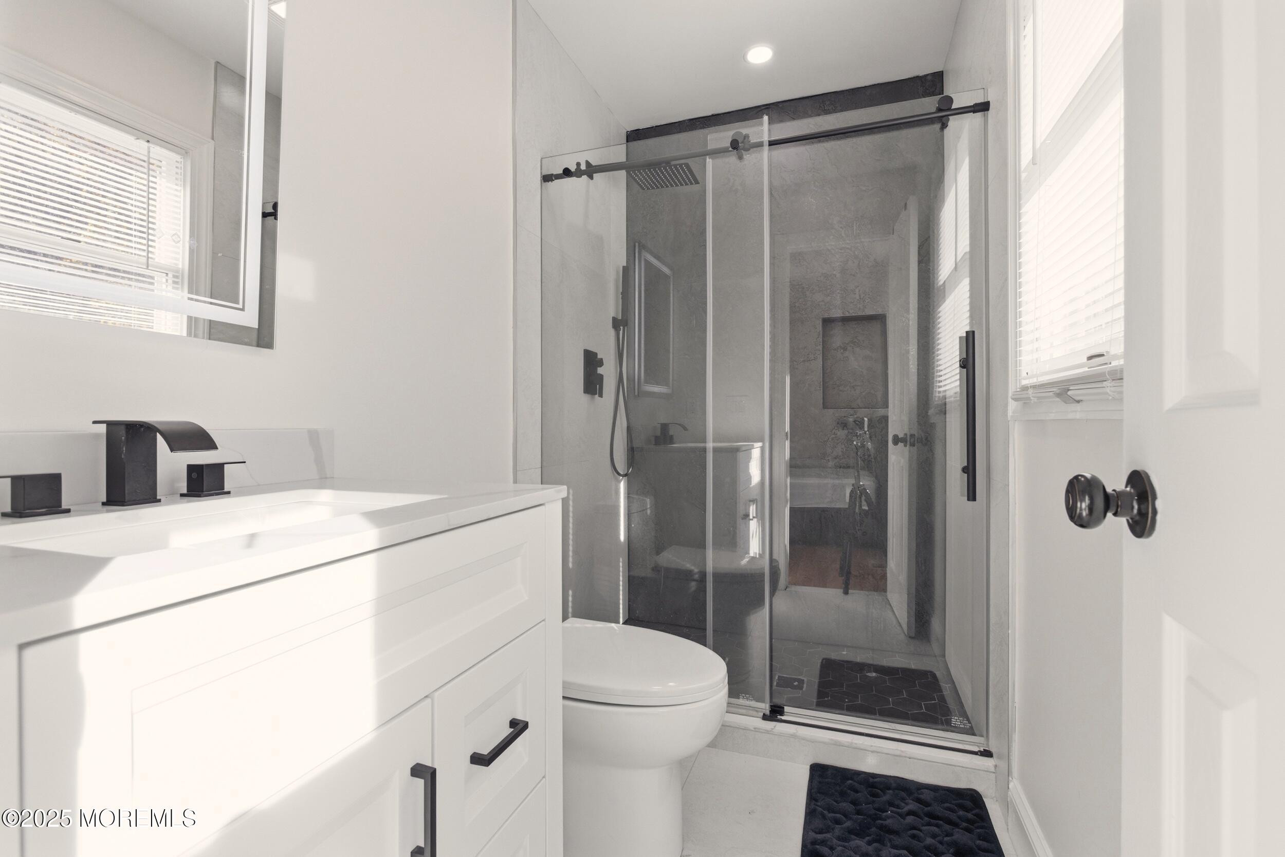 75 Hickory Hill Road Jackson, NJ 08527 - Photo 16 of 30 a bathroom with a granite countertop sink toilet and shower