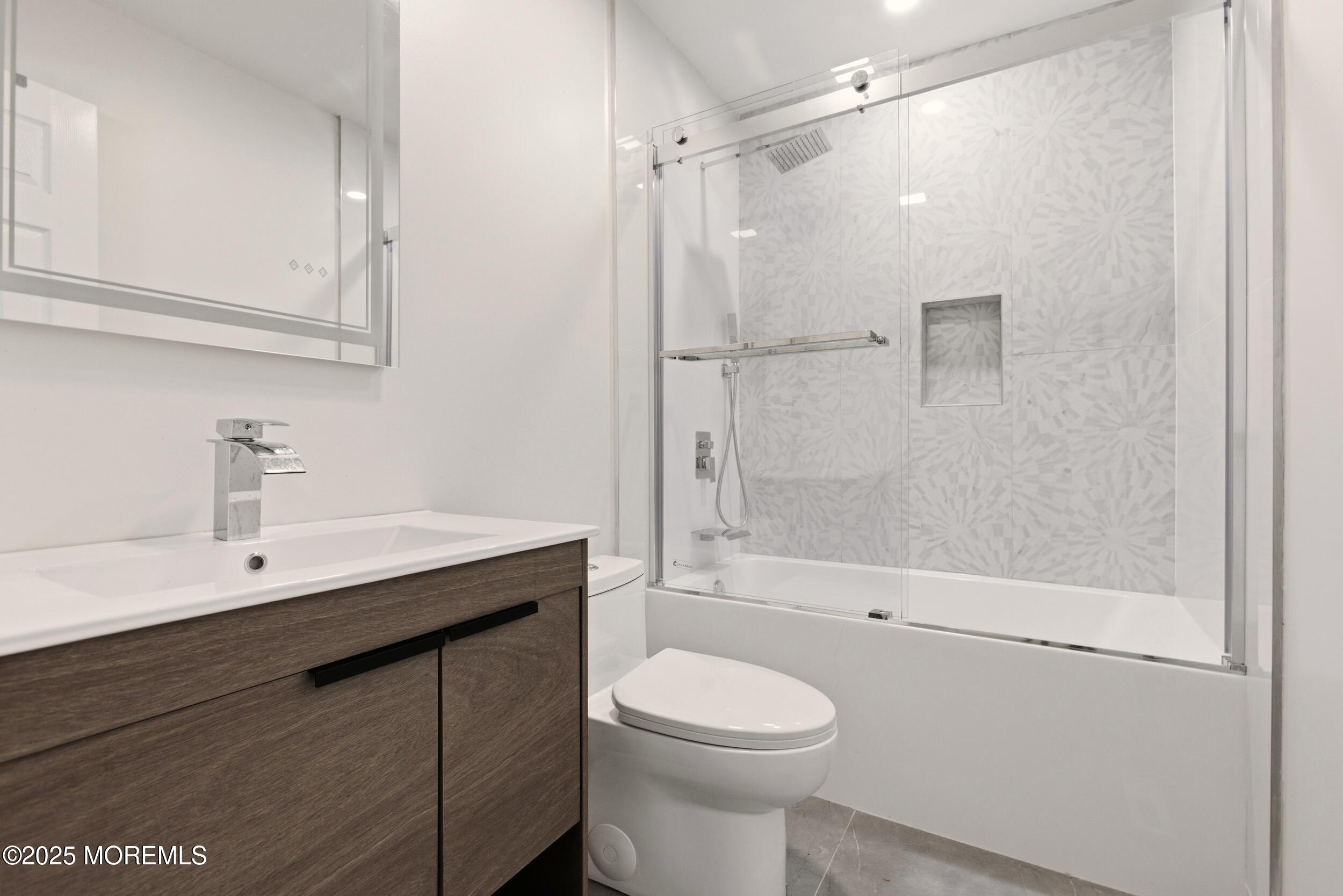 75 Hickory Hill Road Jackson, NJ 08527 - Photo 17 of 30 a bathroom with a sink a toilet and shower