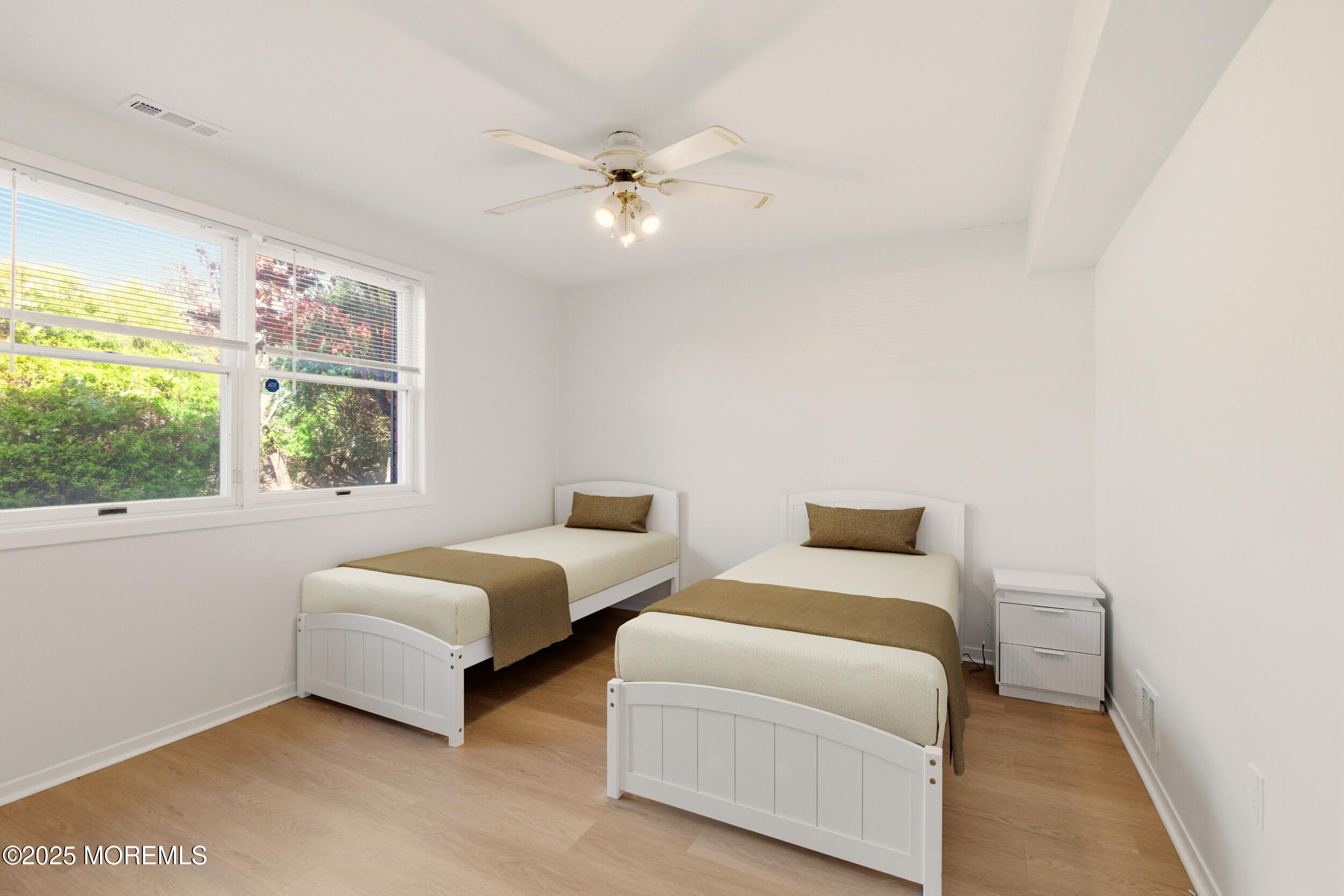 75 Hickory Hill Road Jackson, NJ 08527 - Photo 21 of 30 a bedroom with two beds and a large window