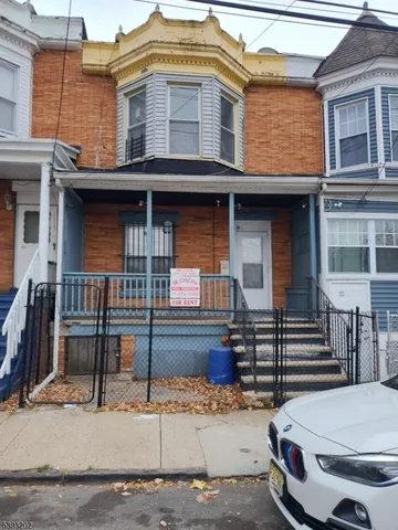 a front view of a house with stairs