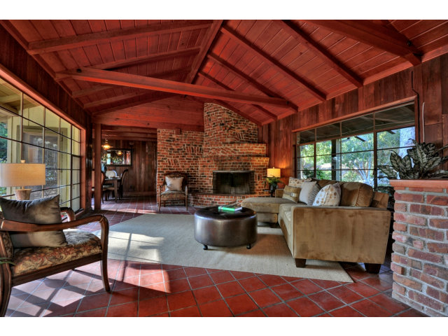 1040 Covington Road Los Altos, CA 94024 - Photo 3 of 19 a living room with furniture a fireplace and a table