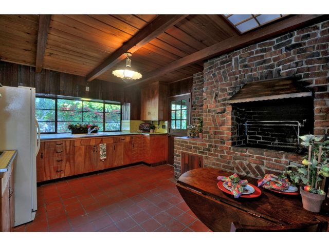1040 Covington Road Los Altos, CA 94024 - Photo 6 of 19 a living room with furniture a flat screen tv and a fireplace