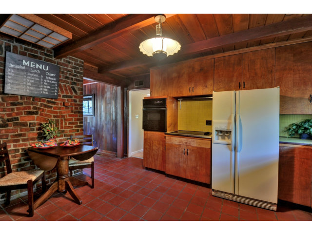 1040 Covington Road Los Altos, CA 94024 - Photo 7 of 19 a kitchen with a refrigerator and a microwave