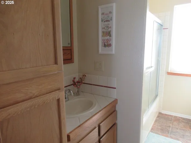 a bathroom with a sink and a mirror