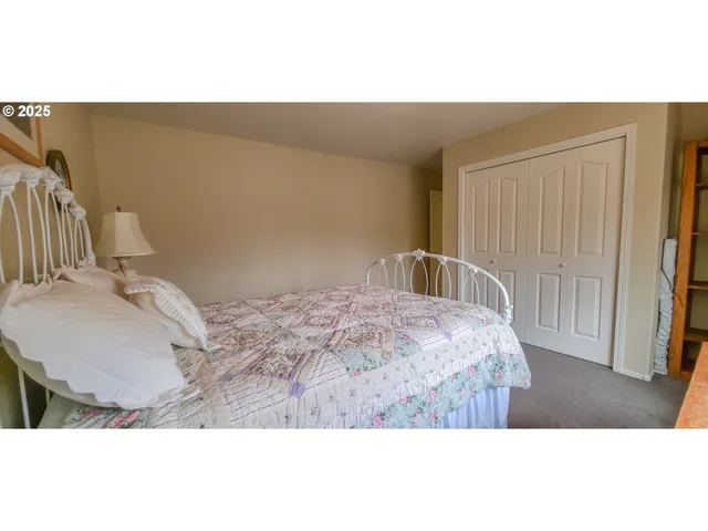 a bedroom with a bed and a cabinets