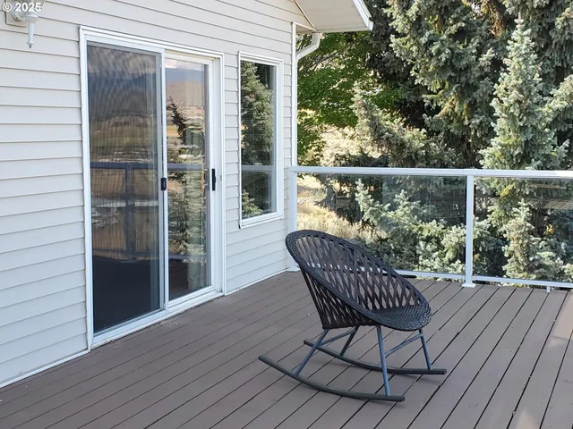a view of a chairs on the roof deck