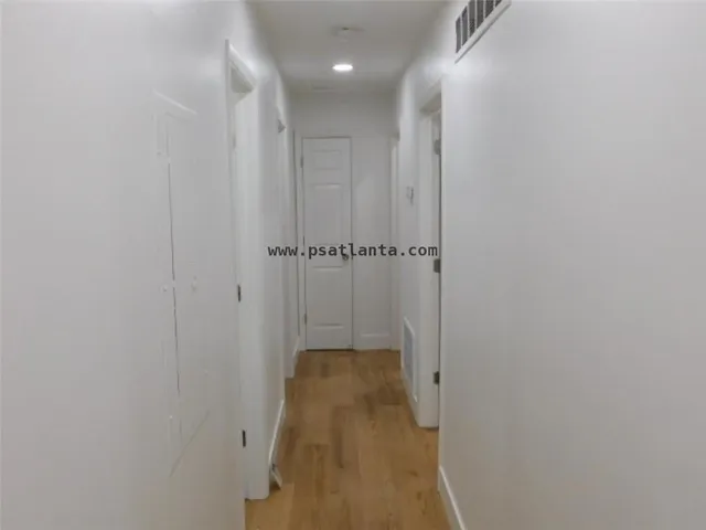 a view of a livingroom with wooden floor