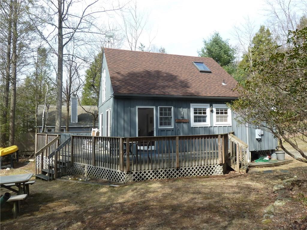 60 Marsh Point Morris, CT 06763 - Photo 1 of 1 a front view of a house with a garden