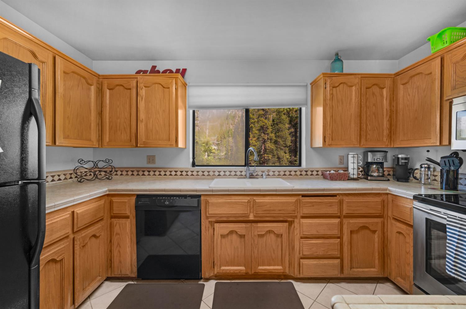 63215 Huntington Vista Road, Unit 80 Mono Hot Springs, CA 93642 - Photo 11 of 58 a kitchen with cabinets appliances and a counter space