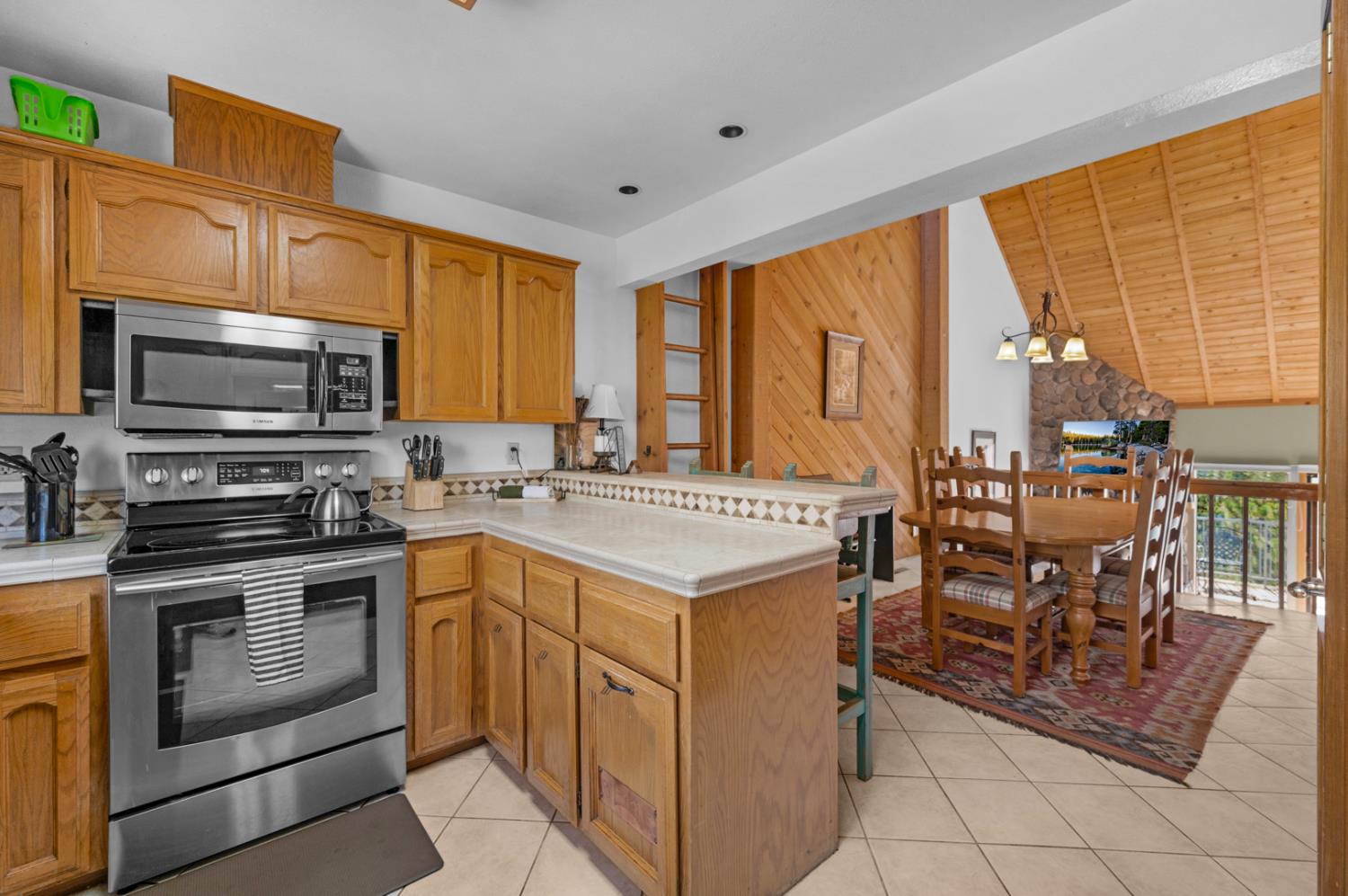 63215 Huntington Vista Road, Unit 80 Mono Hot Springs, CA 93642 - Photo 12 of 58 a kitchen that has a sink and a stove top oven