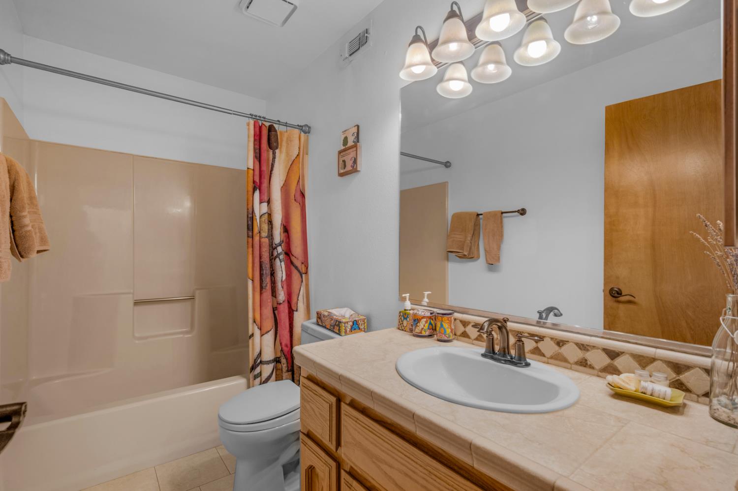 63215 Huntington Vista Road, Unit 80 Mono Hot Springs, CA 93642 - Photo 33 of 58 a bathroom with a granite countertop sink a toilet and shower
