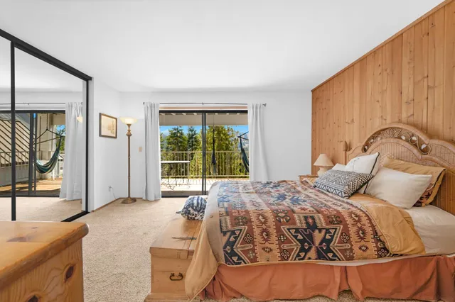 a bathroom with a granite countertop sink mirror and a bathtub