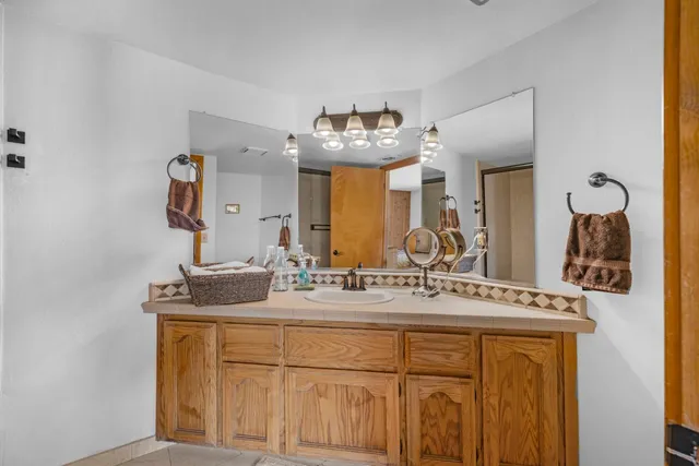 a view of a chair and tables in the balcony