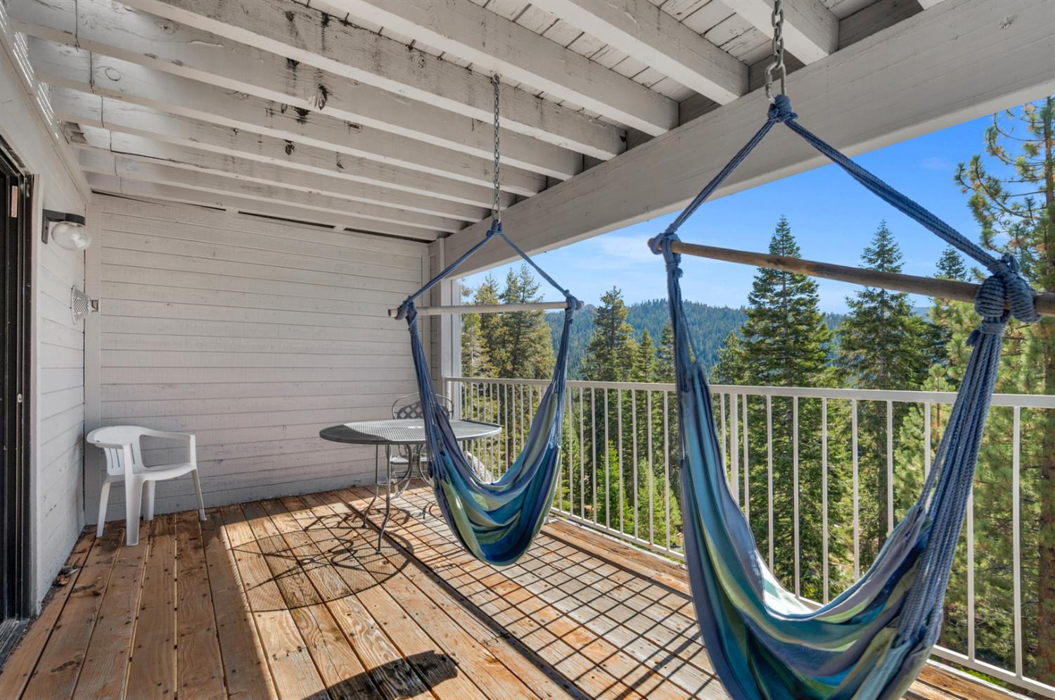 63215 Huntington Vista Road, Unit 80 Mono Hot Springs, CA 93642 - Photo 51 of 58 a view of a balcony with wooden floor and iron stairs