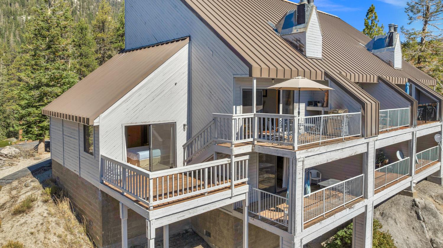 63215 Huntington Vista Road, Unit 80 Mono Hot Springs, CA 93642 - Photo 56 of 58 a front view of a house with a yard