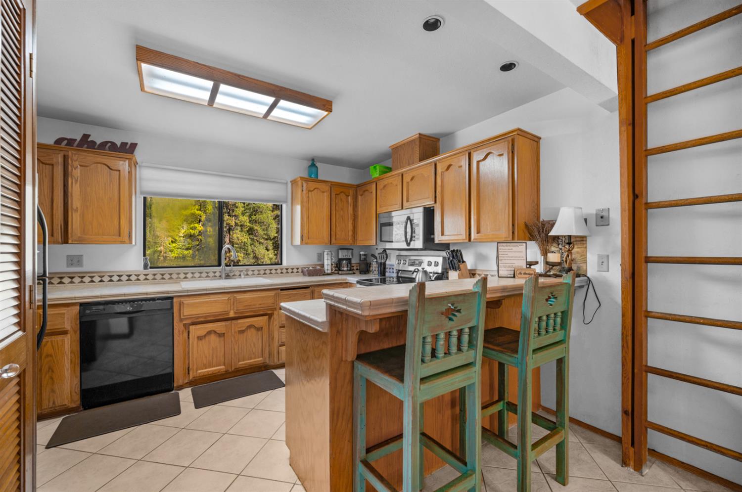 63215 Huntington Vista Road, Unit 80 Mono Hot Springs, CA 93642 - Photo 8 of 58 a kitchen with a sink stove and cabinets