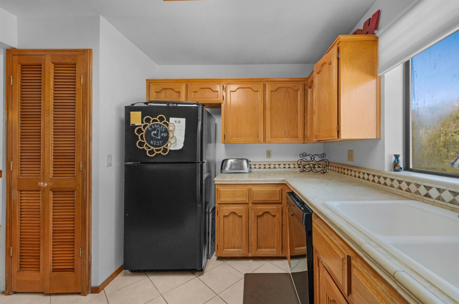 63215 Huntington Vista Road, Unit 80 Mono Hot Springs, CA 93642 - Photo 10 of 58 a kitchen with stainless steel appliances granite countertop a refrigerator and a sink