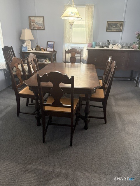 105 Shore Road Clinton, CT 06413 - Photo 8 of 19 Dining area is open to the living room so that the table seating is expandable for larger gatherings.