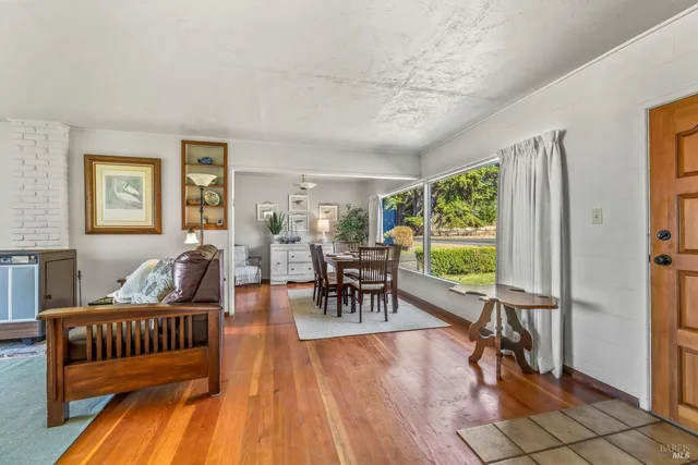 a living room with furniture and a table