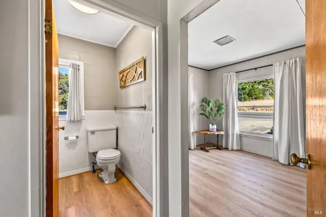 a view of a bathroom with a tub and a view of bathroom