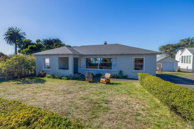 a view of a lake with a yard