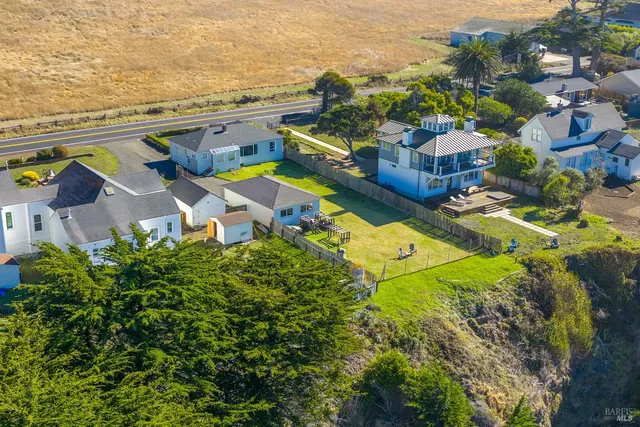 a aerial view of a house with swimming pool garden and patio