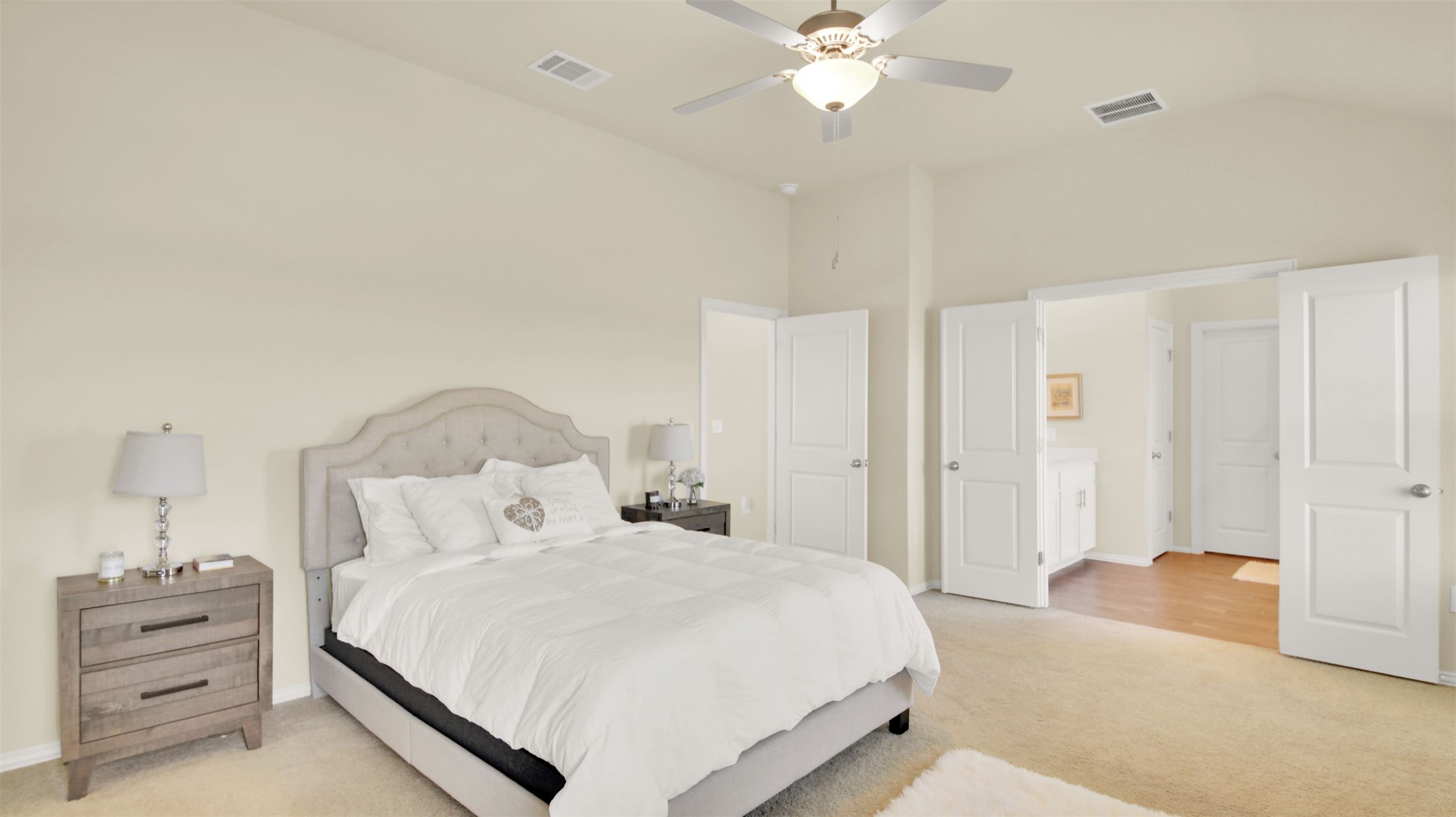 13716 Sugar Bush Path Manor, TX 78653 - Photo 34 of 37 Bedroom featuring light colored carpet, vaulted ceiling, and ceiling fan