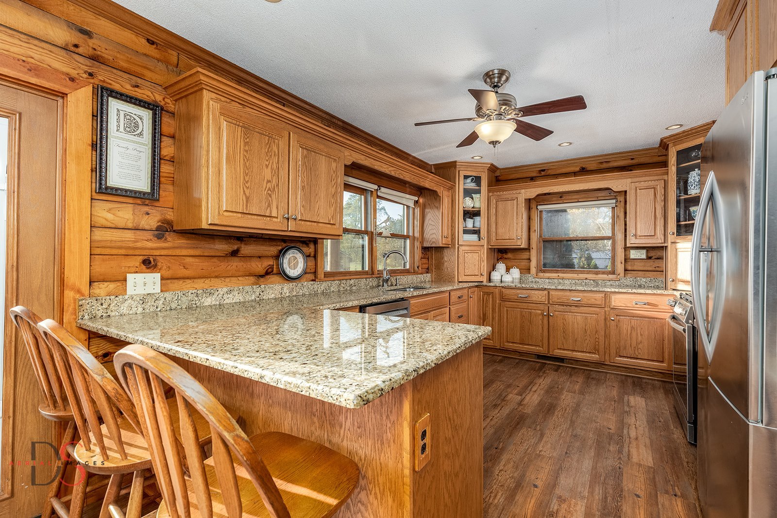 7920 Old Stage Road Morris, IL 60450 - Photo 13 of 43 a kitchen with stainless steel appliances granite countertop a sink a stove and cabinets